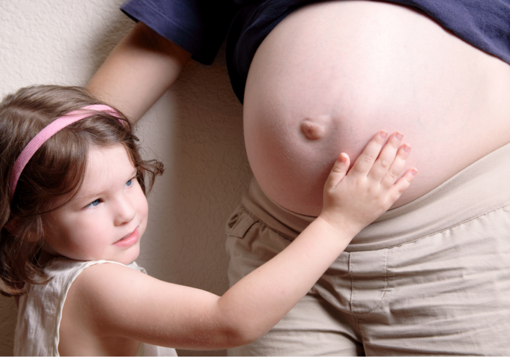 toddler and mommy belly